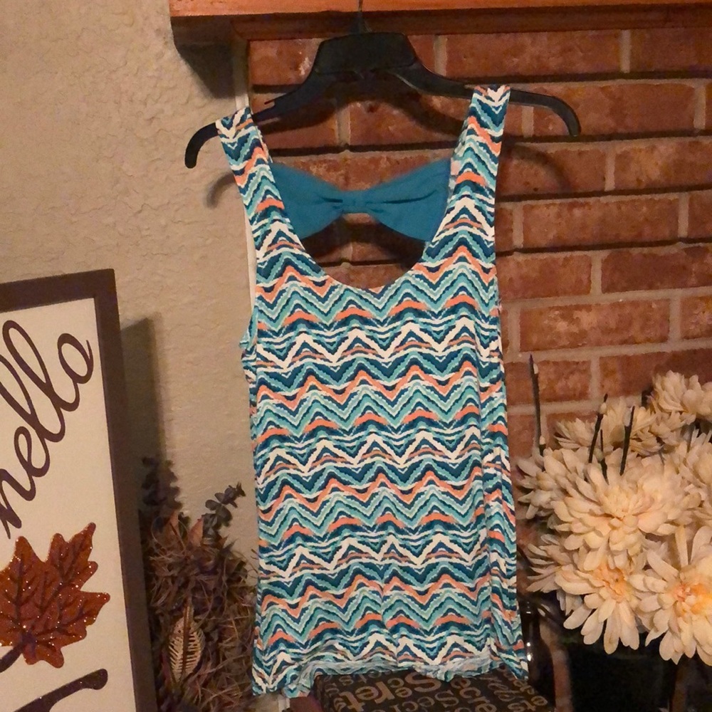 NWT Rue 21 Flowy tank top. Multicolored with teal bow in the back.